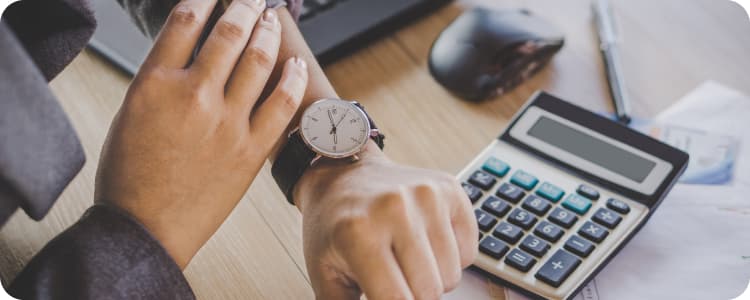 man checking the time on his watch