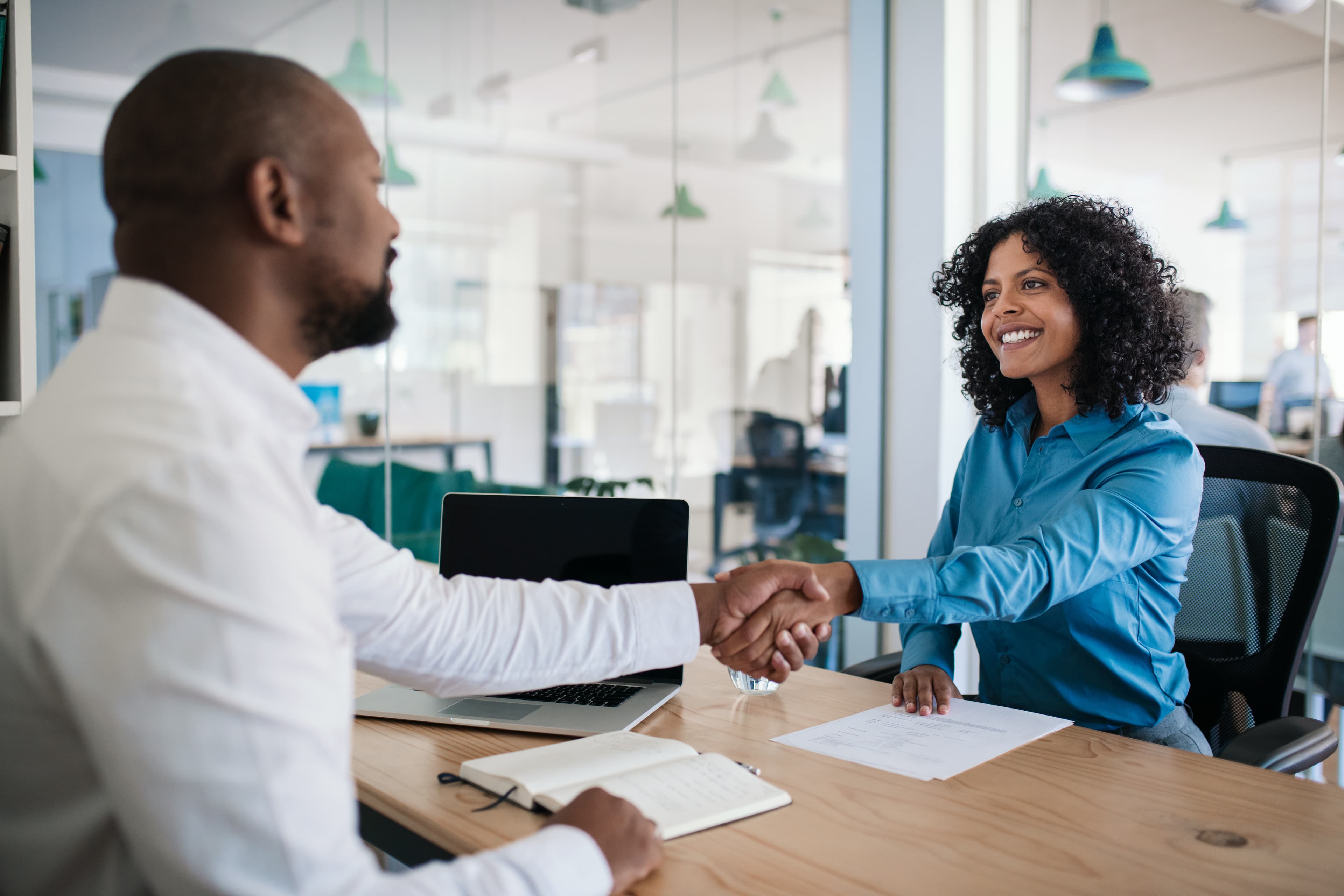 Employees shaking hands